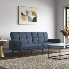 Enveloped in brushed polyester blend upholstery, the sofa showcases elegant button tufting and piped edges for a tailored touch. Jm5xjcqwo0azmm