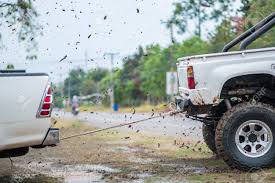 If you have one, use your jack to lift the tires a little then place your cardboard, carpet, plywood or plastic recovery track in front of the wheels. Pulls The Cars Out Of The Mud In Thailand Selective Focus Stock Photo Picture And Royalty Free Image Image 77065298