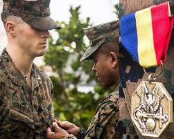 Marine Corps 1st Lt Aaron Cranford Receives The Navy And Marine Corps Medal From Maj Gen Craig Q Timberlak Marine Corps Medals American Heroes Marine Corps