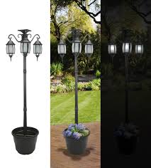 Amazon Com Sunergy 50408190 Madison Solar Lamp Post And Planter With 3 Solar Lighting Lamps Landscape Torch Lights P Solar Lamp Post Solar Lamp Lamp Post