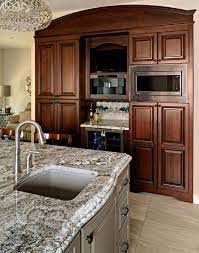 Traditional Cherry Cabinets With Medium Brown Painted Island Crystal Cabinets