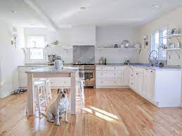 Purchase shelving or create your own by mounting metal pipes to the wall and hanging wood boards on them. The No Backsplash Alternative To Subway Tile Before After Maria Killam