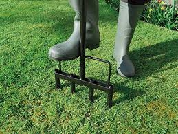 It has a cylinder with multiple spikes on it. Top 7 Best Lawn Aerators Uk Buying Guide And Review