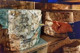 The older the cheddar, the sharper it'll taste. Cheddaring Cheddar Cheese In Cheddar Gorge Travel With Kat