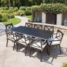 This outdoor dining table is just the right piece to create an outdoor entertaining space on your patio or deck. Eowyn Expandable 7 9 Piece Outdoor Cast Aluminum Dining Set W Umbrell Gdfstudio
