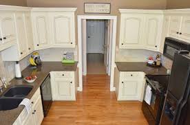Once the lacquer dries, tape along the edges of the backs of the cabinet doors and drawers to protect those areas from glaze and ensure clean lines. How To Glaze Cabinets At Home With The Barkers