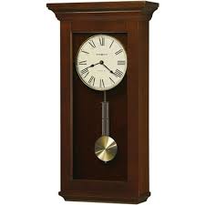 The clock features an open dial with an applied circular brushed nickel finished numeral ring that has arabic numerals at the position of 12, 3, 6, and 9 as well as bar. Brushed Nickel Kitchen Clocks Target