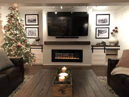 This incredible electric fireplace features two partitioned center shelves, two side cabinets with adjustable shelves and an infrared fireplace insert that boasts spectrafire plus flame technology. Diy Finished Basement Basement Living Rooms Basement Fireplace Living Room With Fireplace