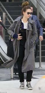 Lily james gets funky in a yellow flare skirt on set of baby driver she's accustomed to wearing brocade gowns in period dramas like war and peace and downton abbey. Lily James And Ansel Elgort Arrive In Melbourne Daily Mail Online
