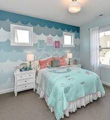 Get inflatable palm trees and hula girls for the tropical look from dollar stores. Mermaid Themed Bedroom Complete With Ocean Wave Detail On Accent Wall Many Different Shades Of Blue Ocean Themed Bedroom Bedroom Themes Mermaid Themed Bedroom