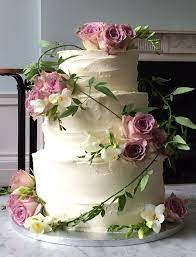 Rustic Buttercream Wedding Cake Dressed With Fresh Dusky Pink Roses And Freesias Pink Wedding Cake Wedding Cake Rustic Dusky Pink Weddings