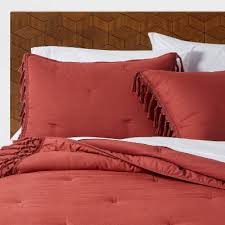 The reversed seams give our 110wx97l. King Macrame Tassel Tufted Quilt Red Rust Opalhouse Target