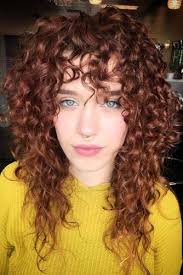 Curly bangs can be a bit of a gamble, but this style pulls the look off with just a few shorter pieces at the fringe, helping to minimize a larger forehead and gently frame. What Is A Deva Cut And Why Your Curls Can T Do Without It