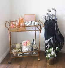 Ornaments, hanging planters, rainfall measurer online. My Golf Themed Bar Cart Decor Tips And Trends Candie Anderson