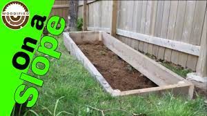 How to build cascading steps. How To Build A Raised Garden Bed On A Slope Youtube