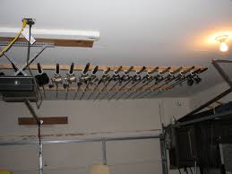 Ripped 2x4 In Half And Attached To Ceiling Rafters Attached Rod Holders To 2x2 Doubt That I Have 20 Tied U Fishing Pole Storage Fishing Rod Storage Rod Rack