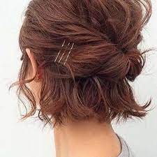 Woman S Chin Length Hair From Behind Pulled Back Into A Loose Horizontal Twist With Three Contrasting Bobby Pins Chin Length Hair Hair Styles Short Hair Updo