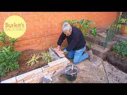 It will help stop grass creeping into your driveway and flowerbeds since it helps to reduce yard maintenance. Burke S Backyard Fake Stone Garden Edging Youtube