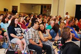 Special-needs students light up the room during graduation