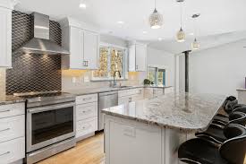 You need backsplashes to protect your walls behind the stove in the kitchen and sink along with protecting the walls behind your stove, our exclusive collection of kitchen backsplash tiles helps you bring your creative kitchen backsplash. Kccne On Twitter Seekonk Ma Kitchen Featuring Nevasca Mist Granite Countertops With An Ogee Edge Finish On Hutch Shaker Cabinets In White Painted Finish Gray Gloss Subway Tile Backsplash Metal Look Accent Tile