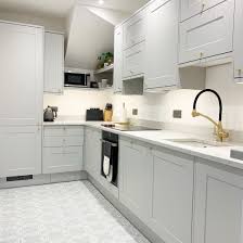 Light grey shaker kitchen white worktops howdens worktops quartz. Chelford Dove Grey Kitchen Kitchen Transformation Light Grey Kitchens Grey Shaker Kitchen