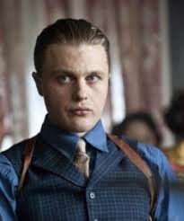 1920s mens hairstyles flashing a smile, a young man in the 1920s wears a slick hairstyle featuring a side part. A Look Back 1920s Hairstyles To Be Remembered Luxxon Hair