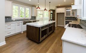 White kitchen cabinets with oak floors. Wide Plank Flooring By Oak Broad Oak Broad