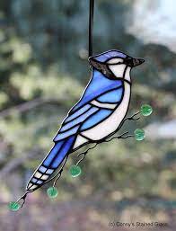 Bluejays are ultra rare land prey in cattails. Blue Jay Stained Glass Suncatcher Stained Glass Birds Stained Glass Stained Glass Patterns
