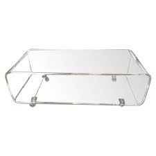 The curved glass body of the coffee table allows it to be beautifully translucent and features tips to save money with lucite coffee table cb2 offer. Cb2 Clear Acrylic Coffee Table Media Console Aptdeco
