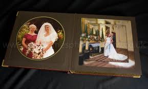 Traditional leather photograph album in cherry red or flamingo pink leather with a genuine hand punched mexican tin heartred and pink leather photo albums. Traditional Handmade Leather Wedding Album In Burgundy