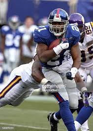New York Giants Running Back Tiki Barber Runs For A First Down In The Third Quarter Of Their 24 To 21 Loss Best Football Team Giants Stadium New York Football