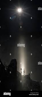 Moon beam created by reflections from ice crystals in air, at full moon  over Grand Canyon, Yelllowstone National Park, Wyoming, USA. January 2016  Stock Photo - Alamy