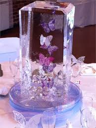 The quinceanera butterfly theme involves butterfly style decorations and costumes, sparkling colours as well as butterfly theme inspired cake. Dancing Butterfly Ice Table Centrepiece From Ice Styling Quince Decorations Sweet 15 Party Ideas Quinceanera Quince Themes