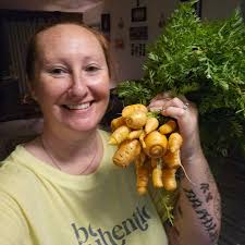 My little raised bed garden is coming along. I already have tiny bell  peppers, tomatoes, and a whole row of baby radishes. I love gardening!