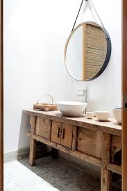 The bathroom is associated with the weekday morning rush, but it doesn't have to be. Distressed Wood Bathroom Vanity Round Mirrored Nightstand Asian Boston With Vanities