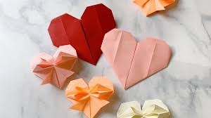 Then, fold the square lengthways and unfold. Origami Hearts Martha Stewart