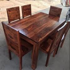 Some common types of table are the dining room table, which is used for seated persons to eat meals; Brown Wooden Design Dining Table Rs 35000 Set N S Furniture Id 20584266730