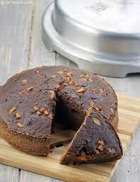 Take a pressure cooker or any thick bottomed pan, spread a layer of sand or salt (about 1 inch) use an old cooker as baking in cooker often, will damage the cooker. Pressure Cooker Chocolate Cake Recipe