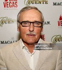 Actor Dennis Hopper and chef Michael Sellman cut Dennis's cake at... News  Photo