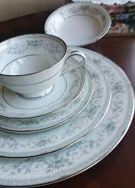 If you find a pattern number, research the number in china collectible books, auction sites or online with companies that offer replacement pieces. Service For 6 Noritake Colburn 36 Piece Dinnerware Set Beautiful Inner Blue Gray Border Roses Platinum Trim Luxury China Set Wedding Gift Dinnerware Beautiful Fine China Dinnerware China Sets
