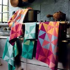 Experience luxury with kitchen towels designed and made in france by garnier thiebaut. Kitchen Towel With Colorful Pinwheels Domus