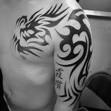 Beautiful tribal dragon having horns tattoo design. 60 Tribal Dragon Tattoo Designs For Men Mythological Ink Ideas Dragon Tattoos For Men Dragon Tattoo Designs Tribal Dragon Tattoos