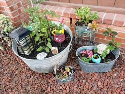 Small Yard With No Ground To Plant Simple Solution Start With Some Cute Buckets Pails Or Cups Etc Put Miracle Grow Soil Plants Small Yard Potting Soil