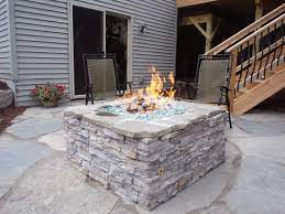 Heat Up Your Patio Paired With Some Comfortable Furniture A Fire Pit Can Turn A Typical Patio Into An In Natural Gas Fire Pit Outdoor Fire Fire Pit Essentials