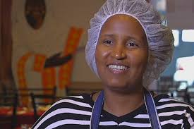 African refugee training others in Brisbane restaurant to help them gain  work