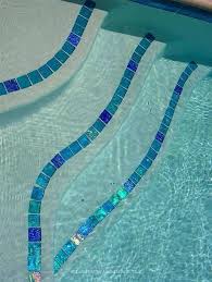 Pool Step Tile In A Combination Of Lightstreams Renaissance Collection Aqua 2 X2 Iridescent Glass Tiles And Intermitt Pool Steps Pool Tile Swimming Pool Tiles