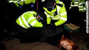 A photograph of sarah everard sits among the floral tributes and candles placed in clapham common in london on march 15. Sarah Everard Fury As London Police Officers Break Up Vigil To Murdered Woman Cnn