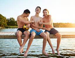Two teenage friends tickling their mate stock photo (139130) -  YouWorkForThem