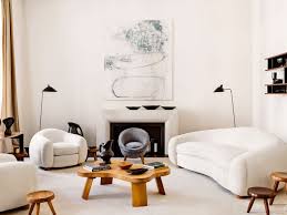 More white bear cub coffee table with beveled glass oval top. The Story Behind Jean Royere S Iconic Design Architectural Digest