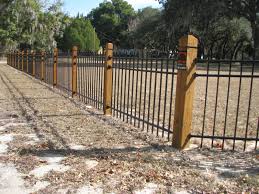 Specialty Fence Design By Mossy Oak Fence Company In Orlando And Melbourne Fl Wood Stained Posts Aluminum F Fence Design Building A Fence Fence Around Pool